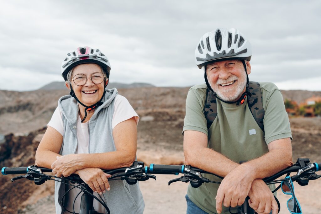 Portrait of couple of old and happy in love seniors looking at the camera smiling