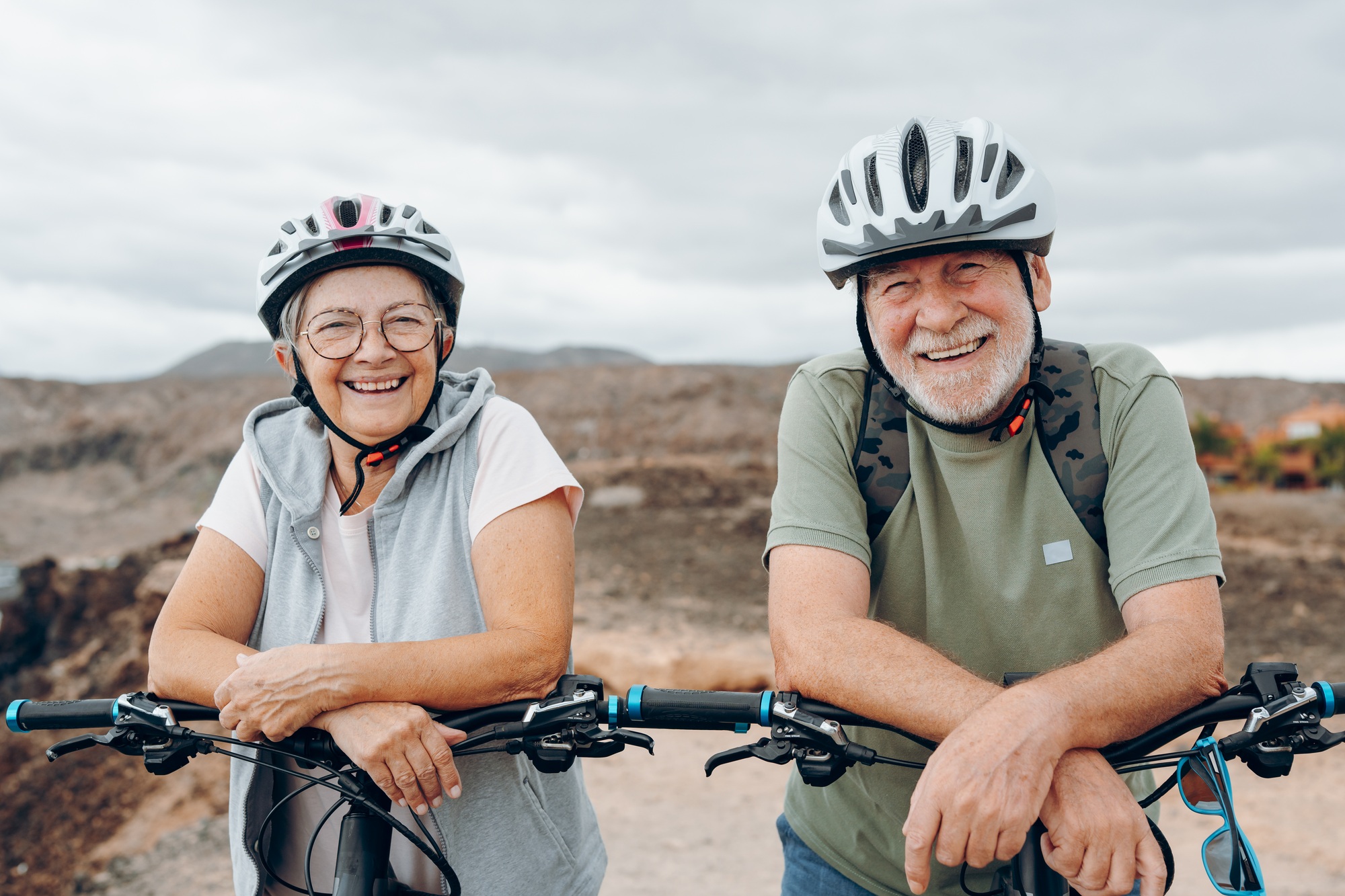 Portrait of couple of old and happy in love seniors looking at the camera smiling